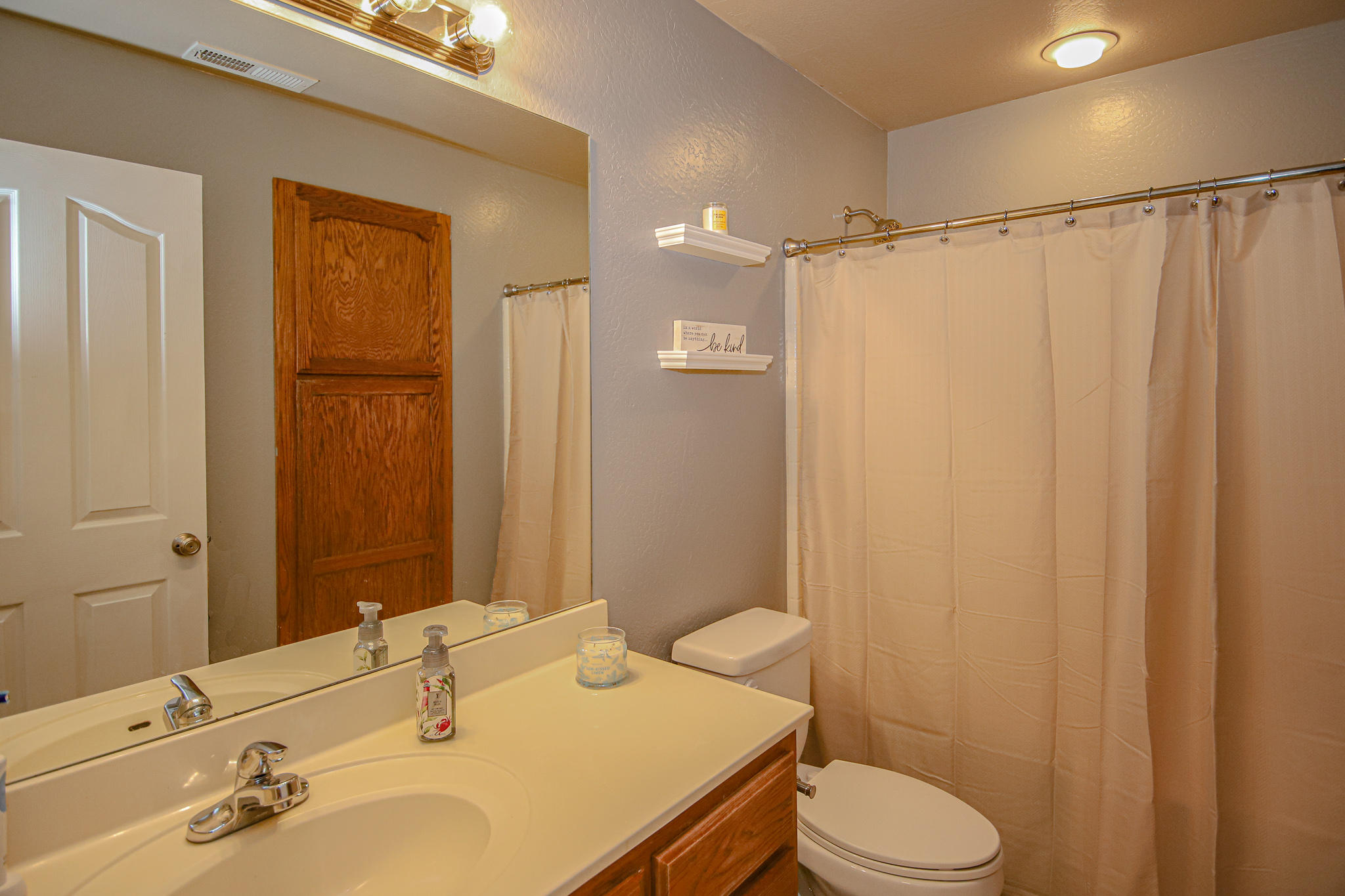 623 Barton Road Eagle Point, OR 97524 - Photo 22 of 28 a bathroom with a sink toilet and shower