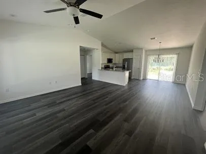 a view of a living room hardwood and furniture