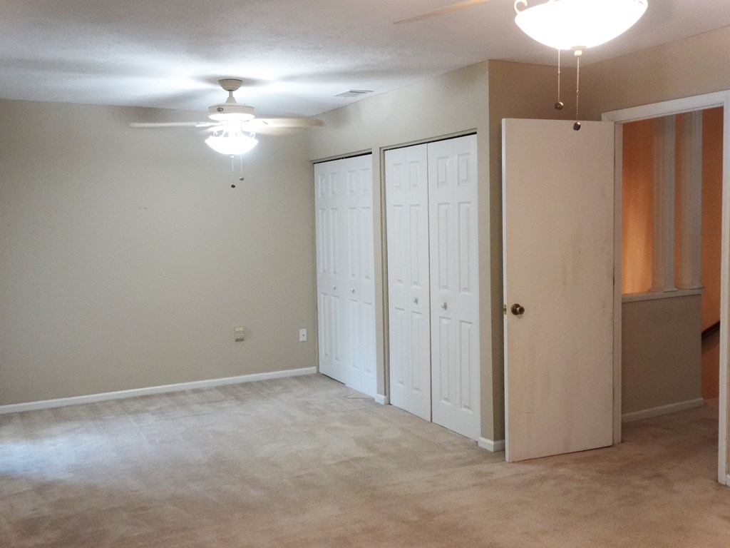 2525 Norris Road, Unit 113 Columbus, GA 31907 - Photo 12 of 40 a view of an empty room with a chandelier fan