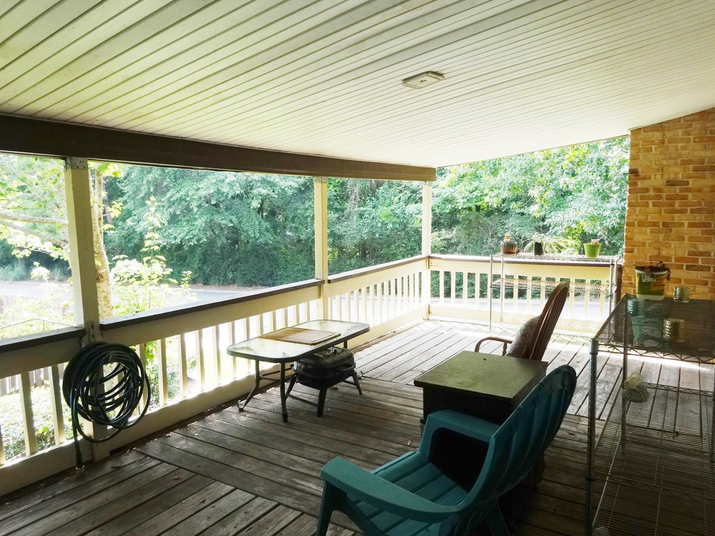 2525 Norris Road, Unit 113 Columbus, GA 31907 - Photo 16 of 40 a view of a balcony with furniture and wooden floor