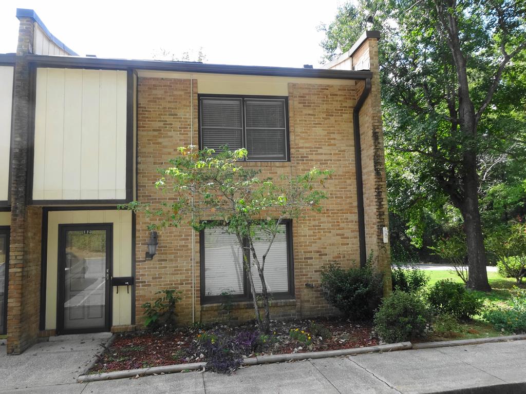 2525 Norris Road, Unit 113 Columbus, GA 31907 - Photo 38 of 40 a stone house with potted plants in front of it