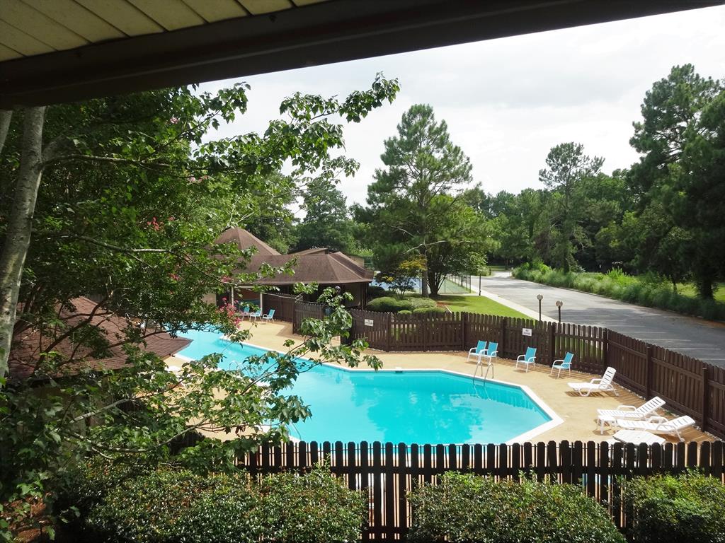 2525 Norris Road, Unit 113 Columbus, GA 31907 - Photo 39 of 40 a view of a swimming pool and lounge chairs