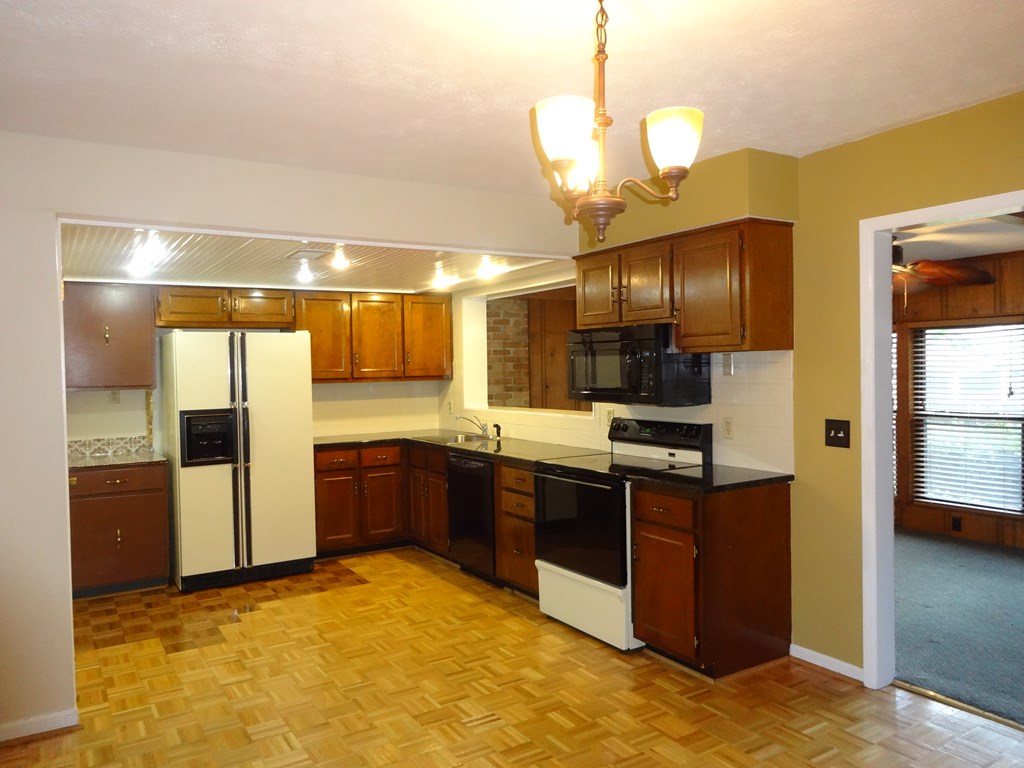 2525 Norris Road, Unit 113 Columbus, GA 31907 - Photo 4 of 40 a large kitchen with a sink and stainless steel appliances