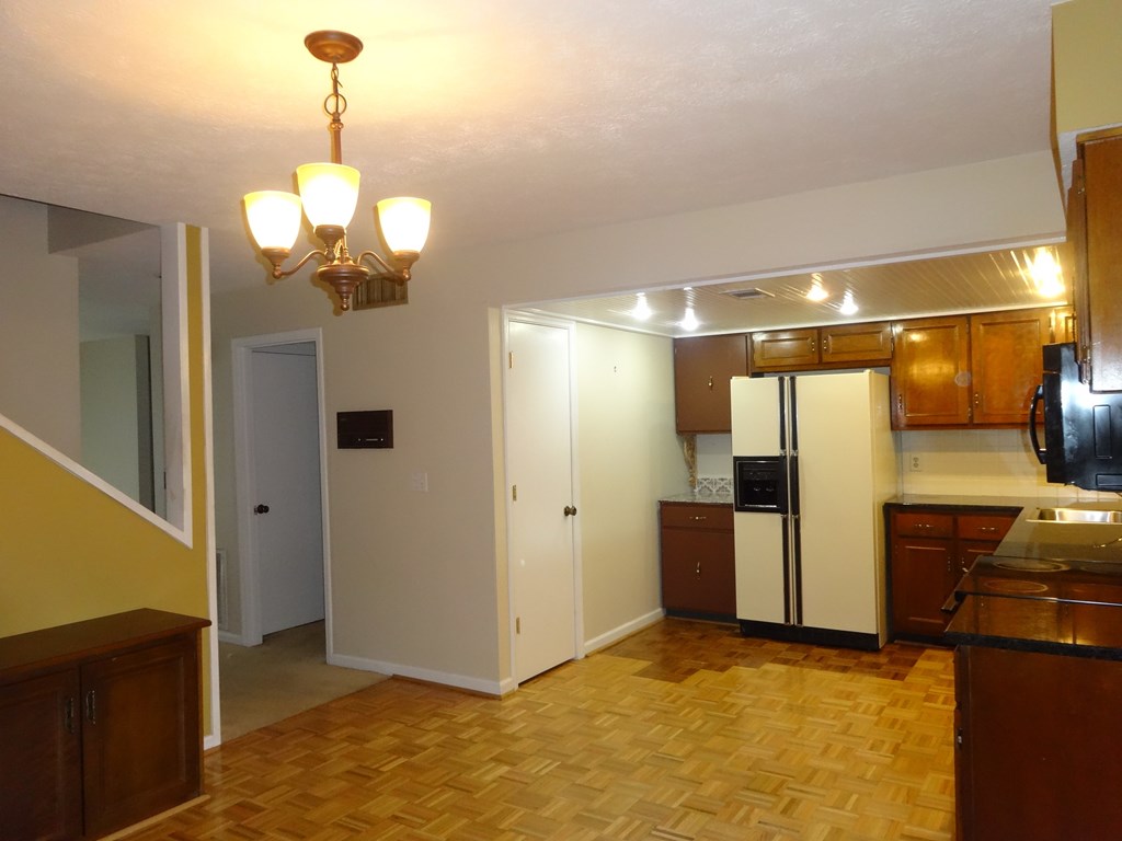 2525 Norris Road, Unit 113 Columbus, GA 31907 - Photo 7 of 40 a view of a livingroom with a chandelier