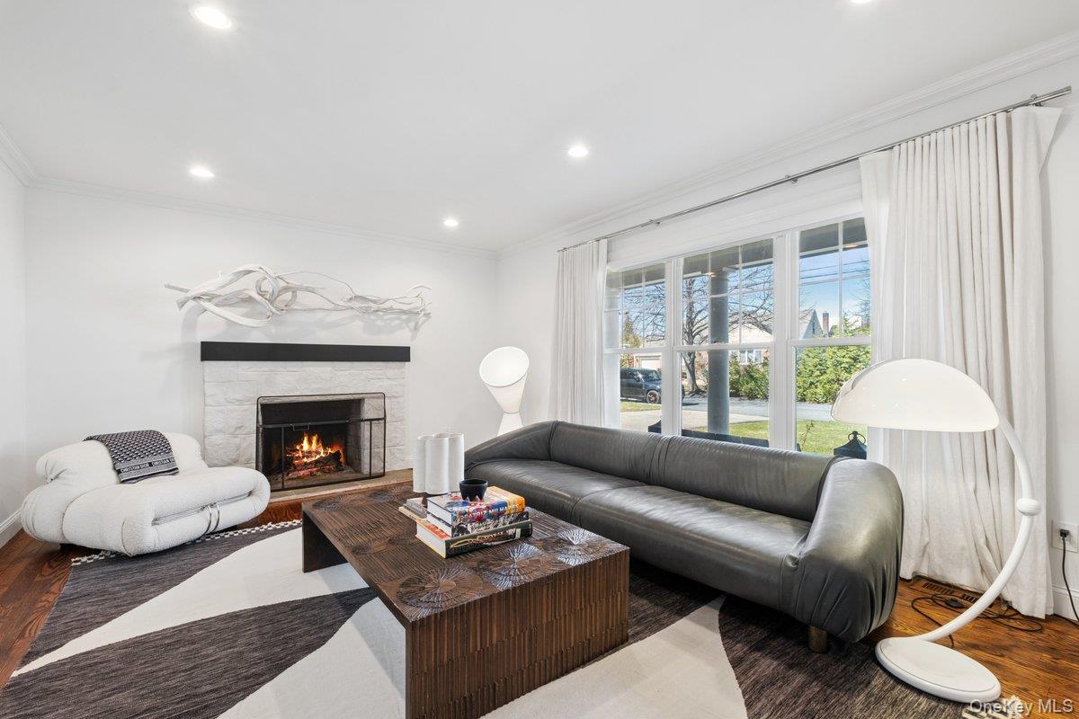 73 Atherstone Road Scarsdale, NY 10583 - Photo 11 of 34 a living room with furniture and a fireplace