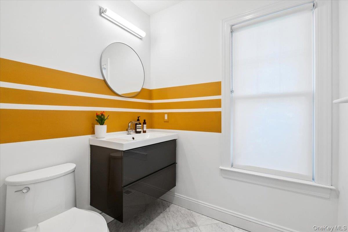 73 Atherstone Road Scarsdale, NY 10583 - Photo 14 of 34 a bathroom with a sink and a toilet