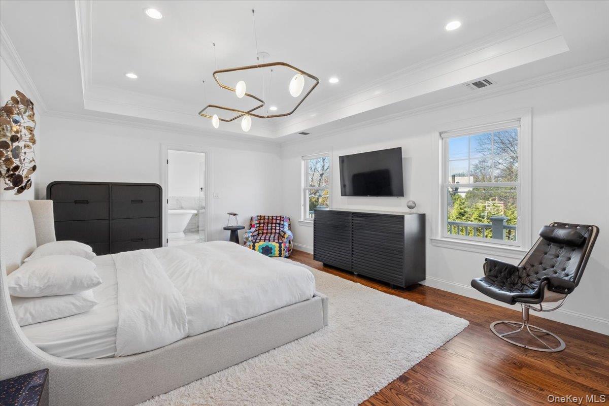 73 Atherstone Road Scarsdale, NY 10583 - Photo 15 of 34 a bedroom with a bed and a television