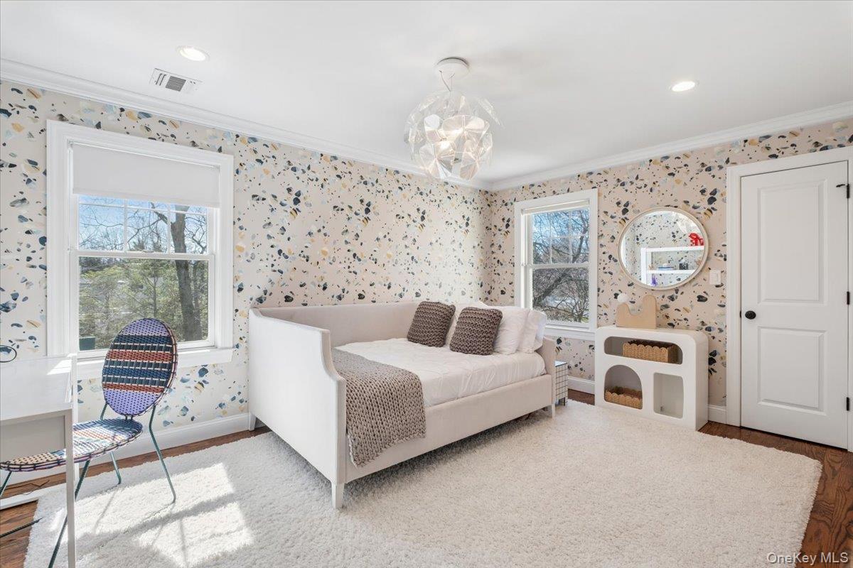 73 Atherstone Road Scarsdale, NY 10583 - Photo 17 of 34 a living room with furniture and a chandelier