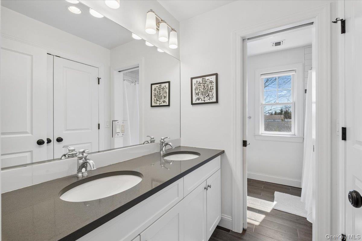 73 Atherstone Road Scarsdale, NY 10583 - Photo 19 of 34 a bathroom with a sink and a mirror