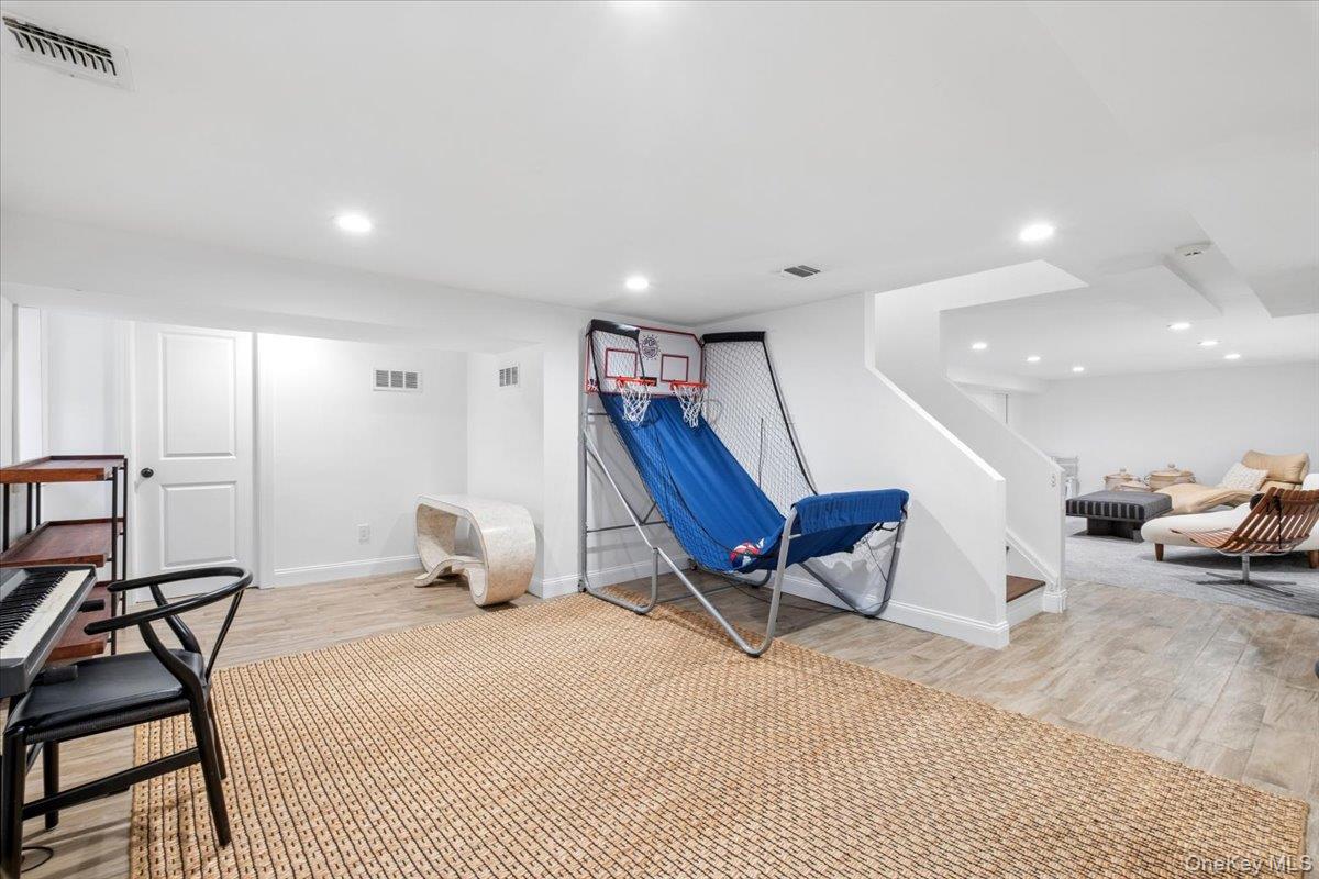 73 Atherstone Road Scarsdale, NY 10583 - Photo 26 of 34 a bedroom with furniture and a rug