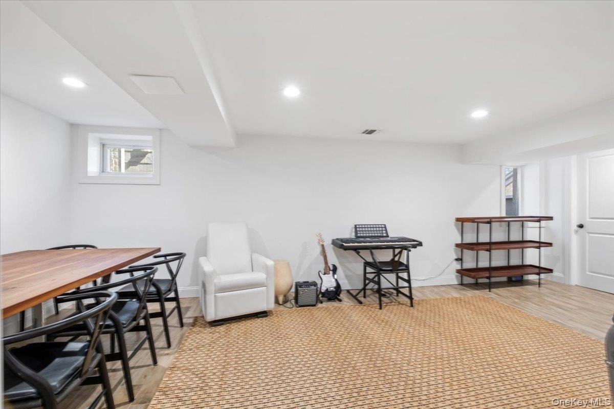 73 Atherstone Road Scarsdale, NY 10583 - Photo 27 of 34 a bedroom with furniture and a book shelf