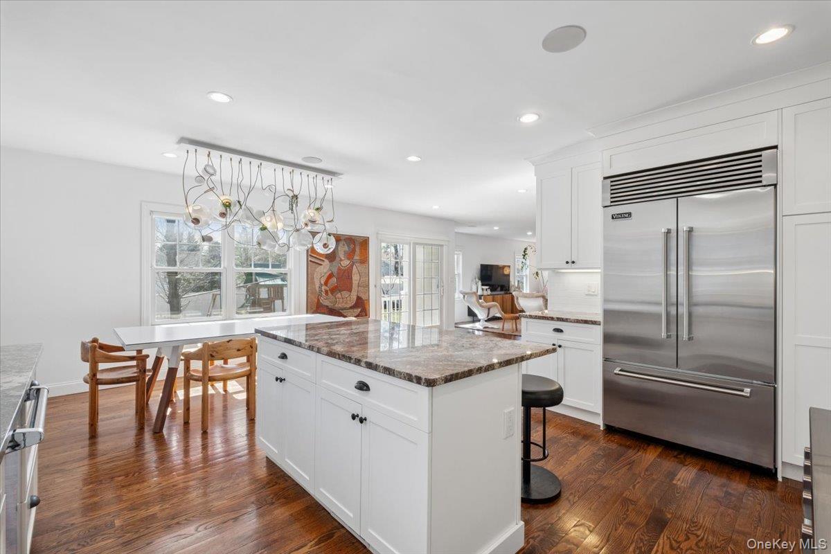 73 Atherstone Road Scarsdale, NY 10583 - Photo 5 of 34 a kitchen with granite countertop a refrigerator and a stove top oven