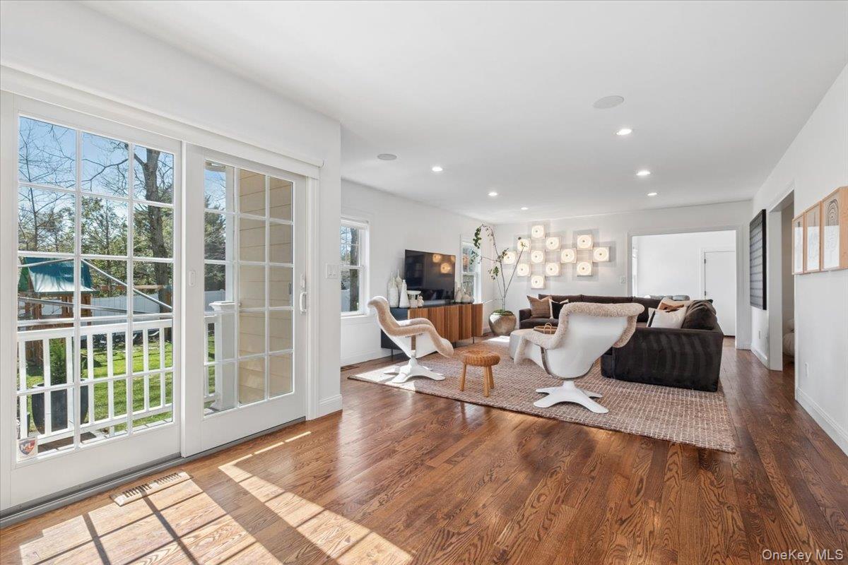 73 Atherstone Road Scarsdale, NY 10583 - Photo 8 of 34 a living room with furniture and a large window