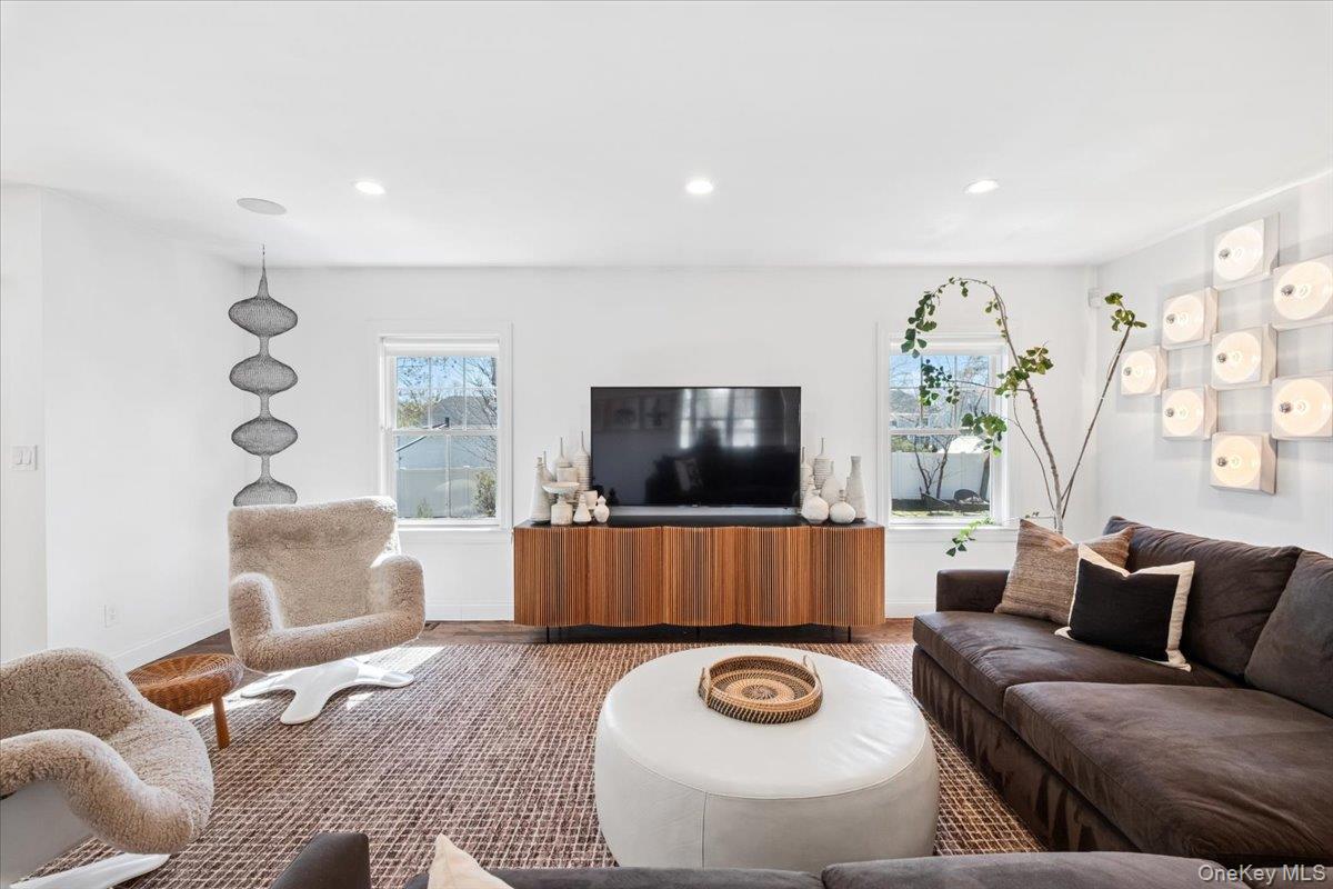 73 Atherstone Road Scarsdale, NY 10583 - Photo 9 of 34 a living room with furniture and a flat screen tv