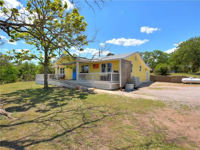 a view of yard with swimming pool and green space