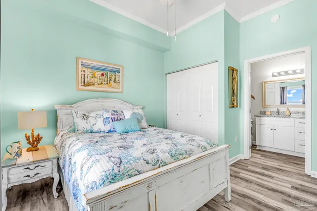 a bedroom with a bad and dresser