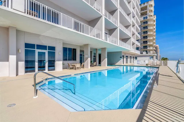 swimming pool view with a outdoor seating space