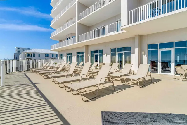 a view of a building with sitting area