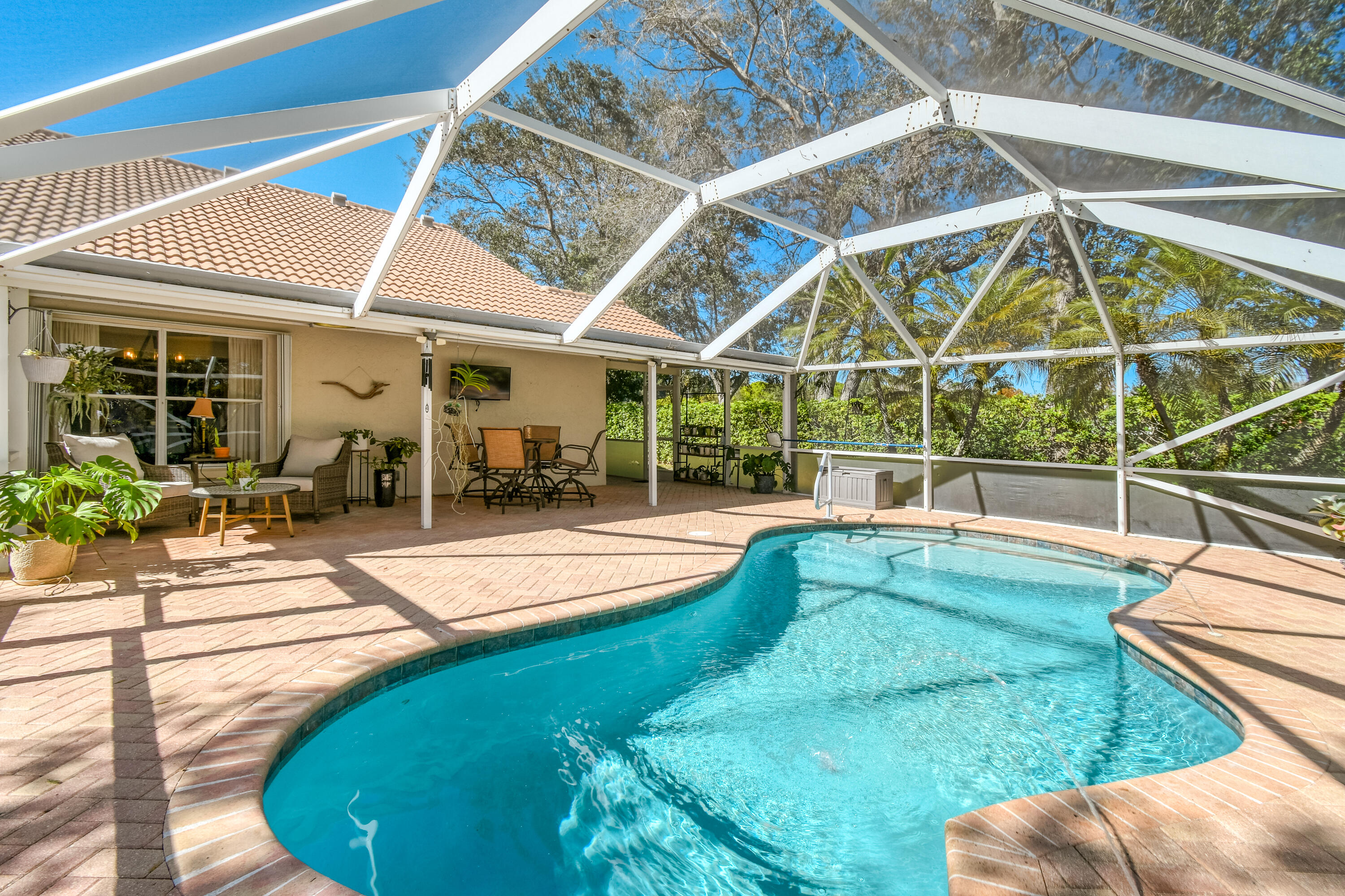 163 Spoonbill Court Jupiter, FL 33458 - Photo 1 of 67 a view of a house with backyard and sitting area