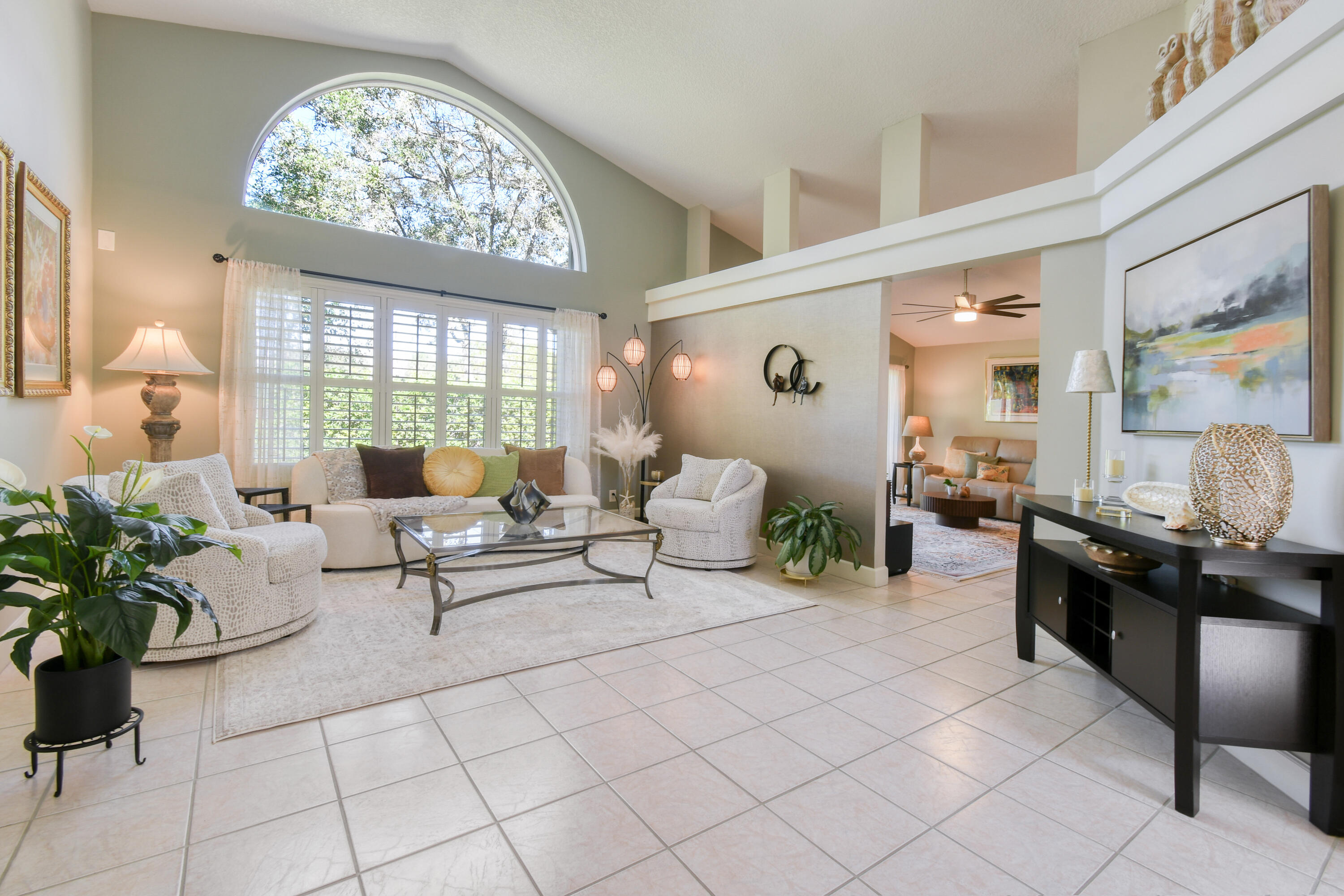 163 Spoonbill Court Jupiter, FL 33458 - Photo 13 of 67 a living room with furniture and a large window