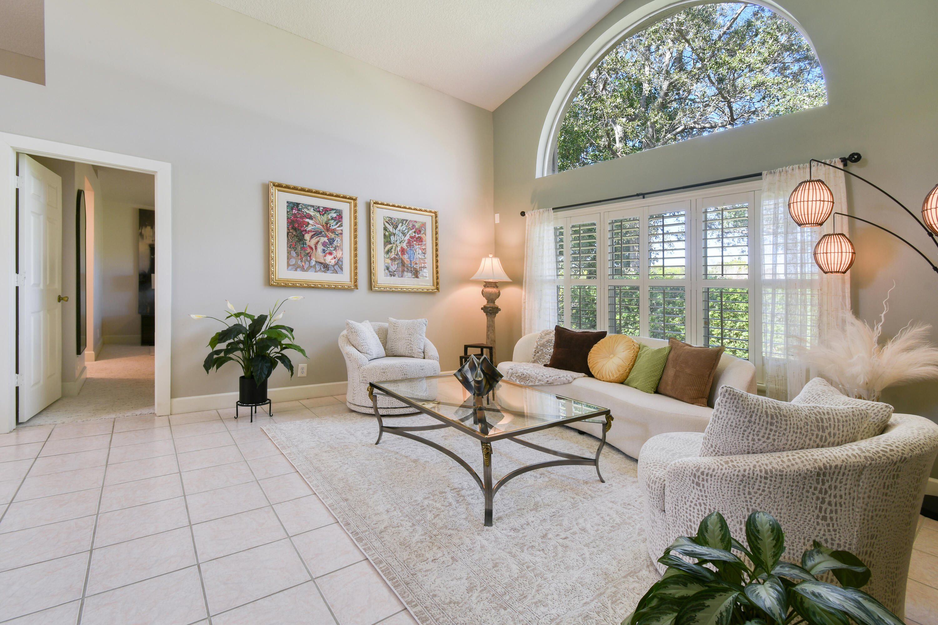163 Spoonbill Court Jupiter, FL 33458 - Photo 14 of 67 a living room with furniture and a large window