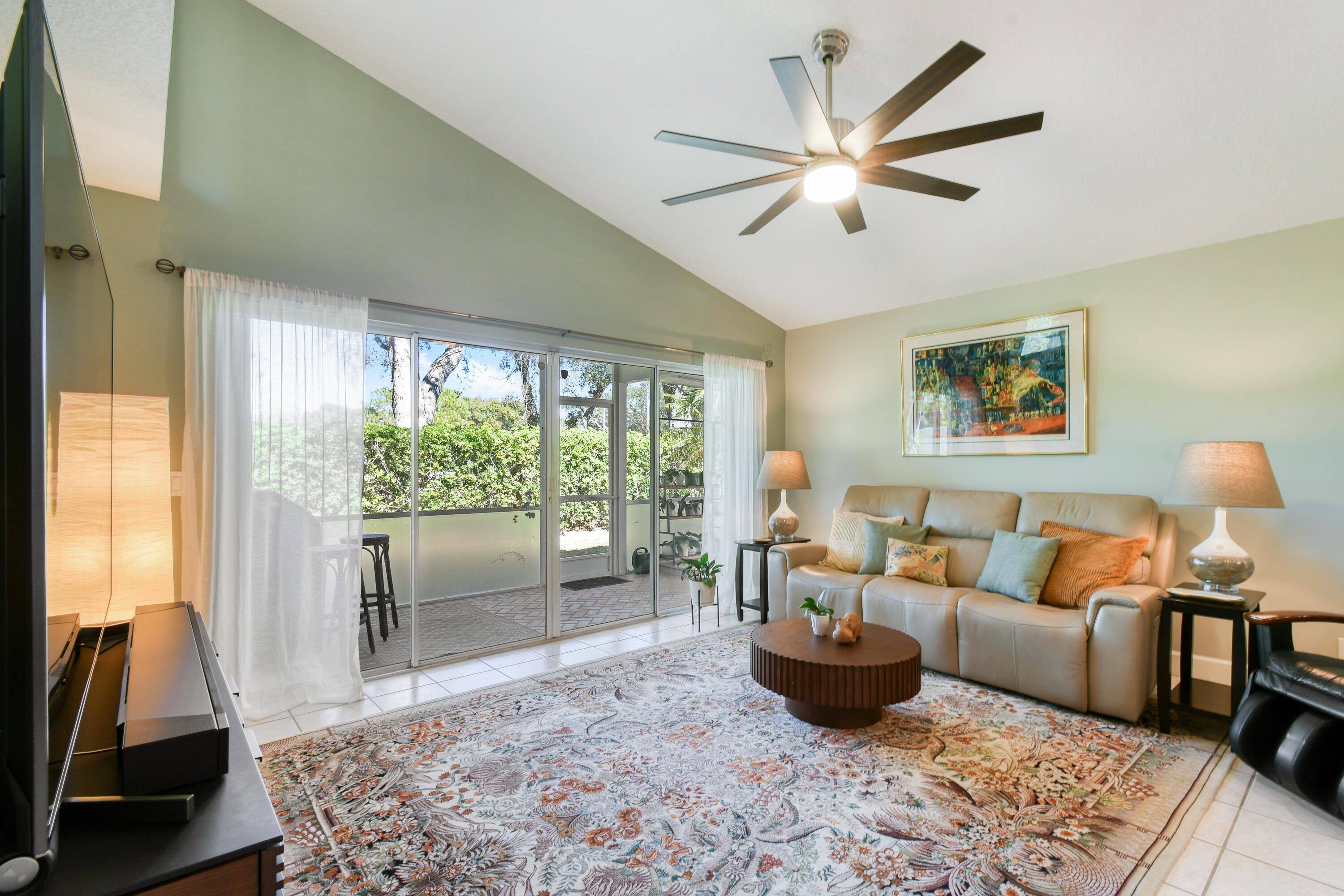 163 Spoonbill Court Jupiter, FL 33458 - Photo 27 of 67 a living room with furniture and a large window