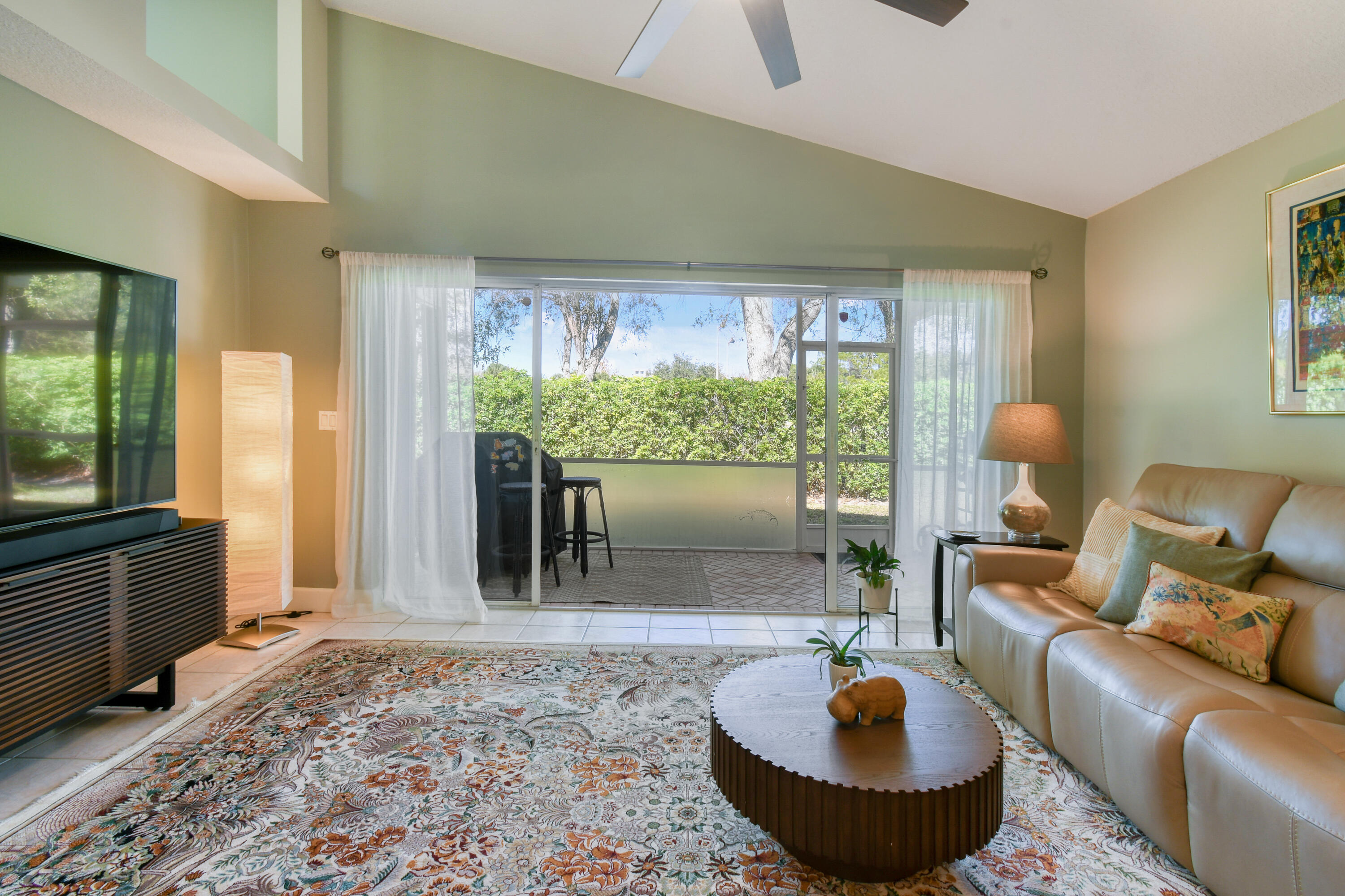 163 Spoonbill Court Jupiter, FL 33458 - Photo 28 of 67 a living room with furniture and a large window