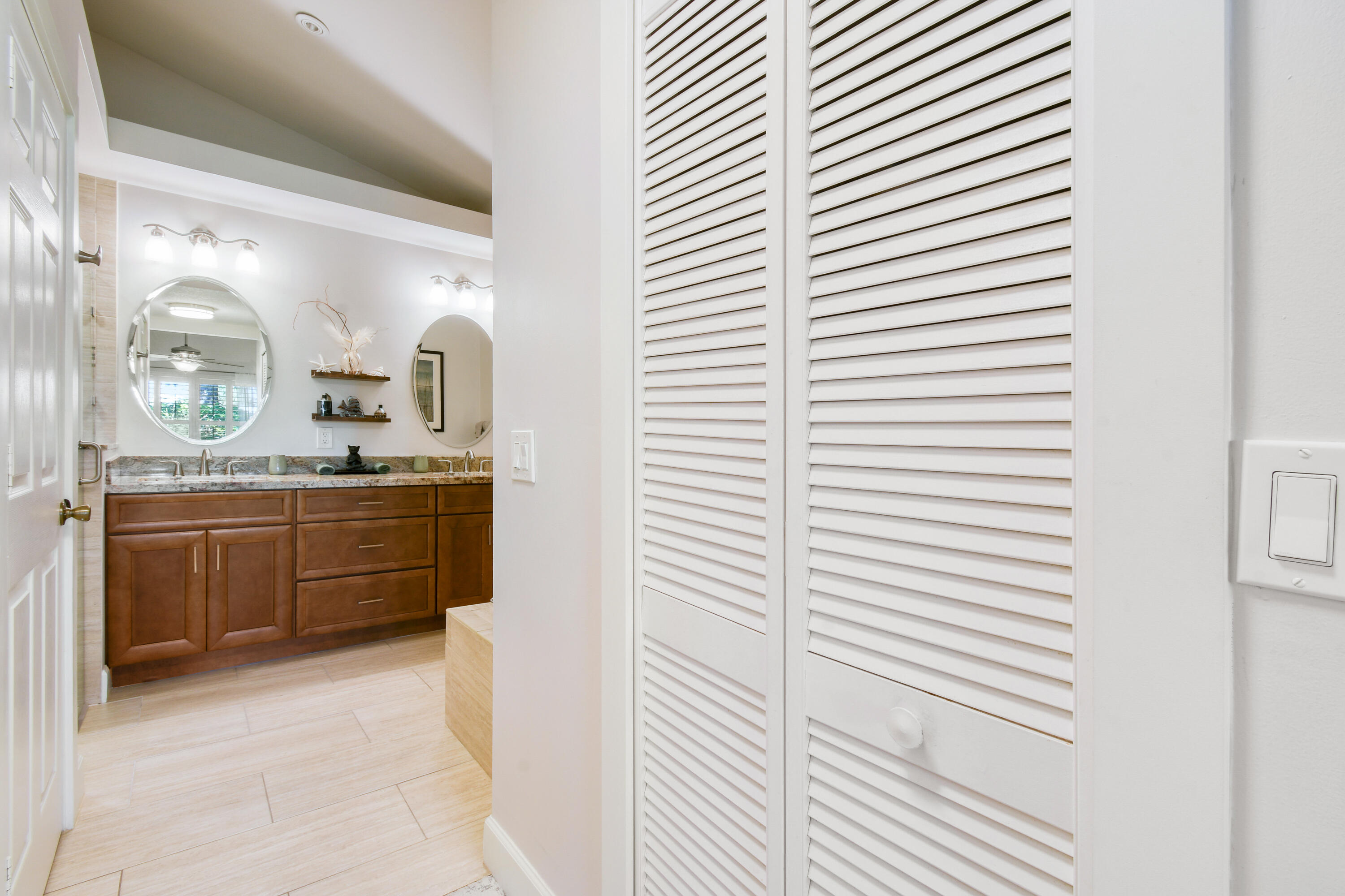 163 Spoonbill Court Jupiter, FL 33458 - Photo 32 of 67 a bathroom with a sink and a mirror