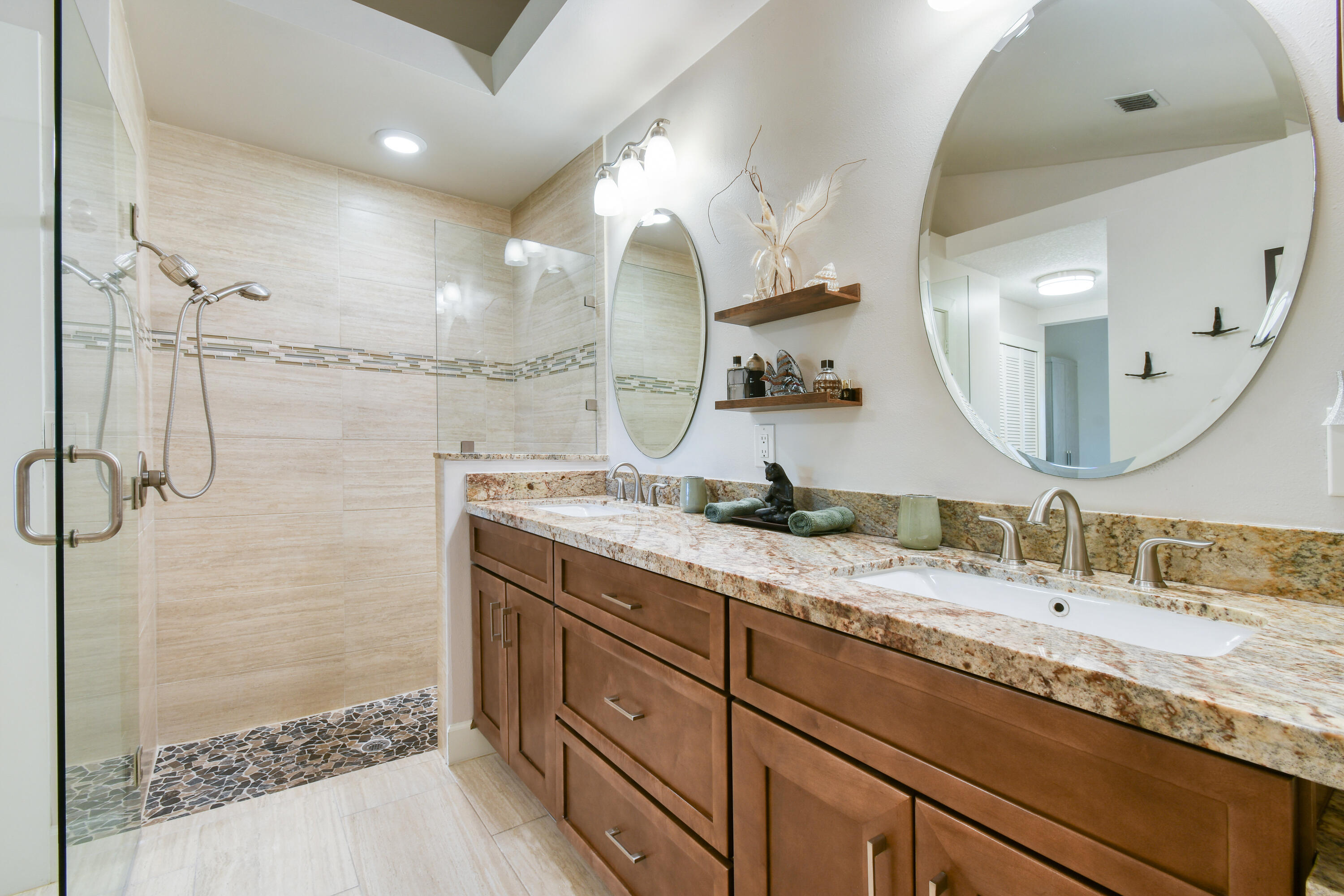 163 Spoonbill Court Jupiter, FL 33458 - Photo 33 of 67 a bathroom with a granite countertop double vanity sink and mirror