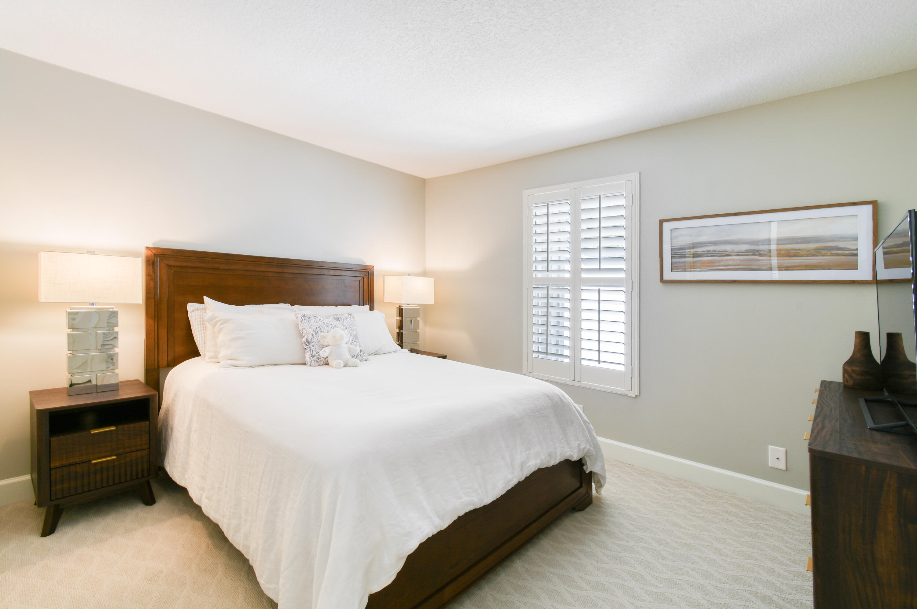 163 Spoonbill Court Jupiter, FL 33458 - Photo 36 of 67 a bedroom with a bed and a window