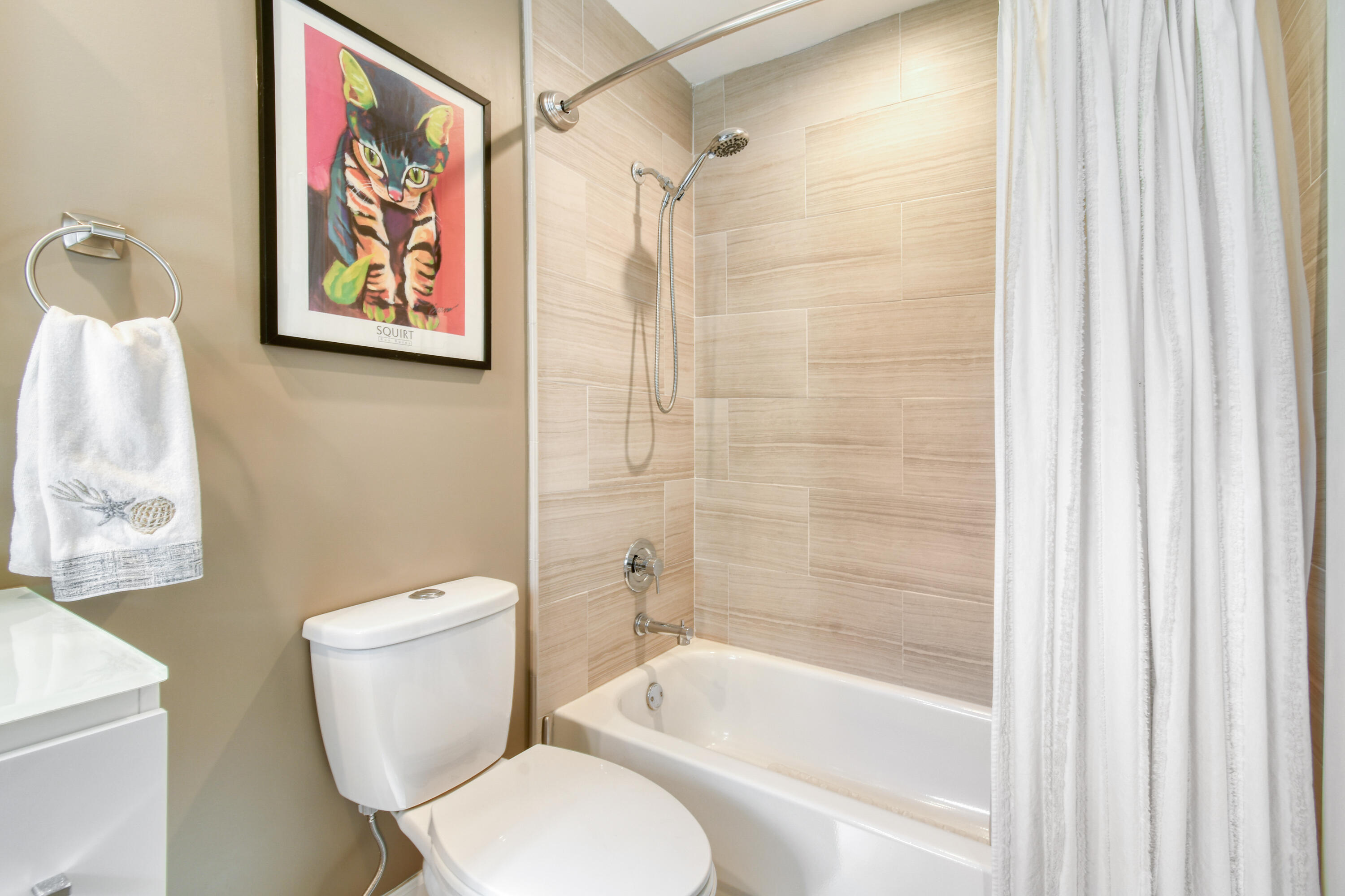 163 Spoonbill Court Jupiter, FL 33458 - Photo 39 of 67 a white toilet sitting next to a bath tub shower