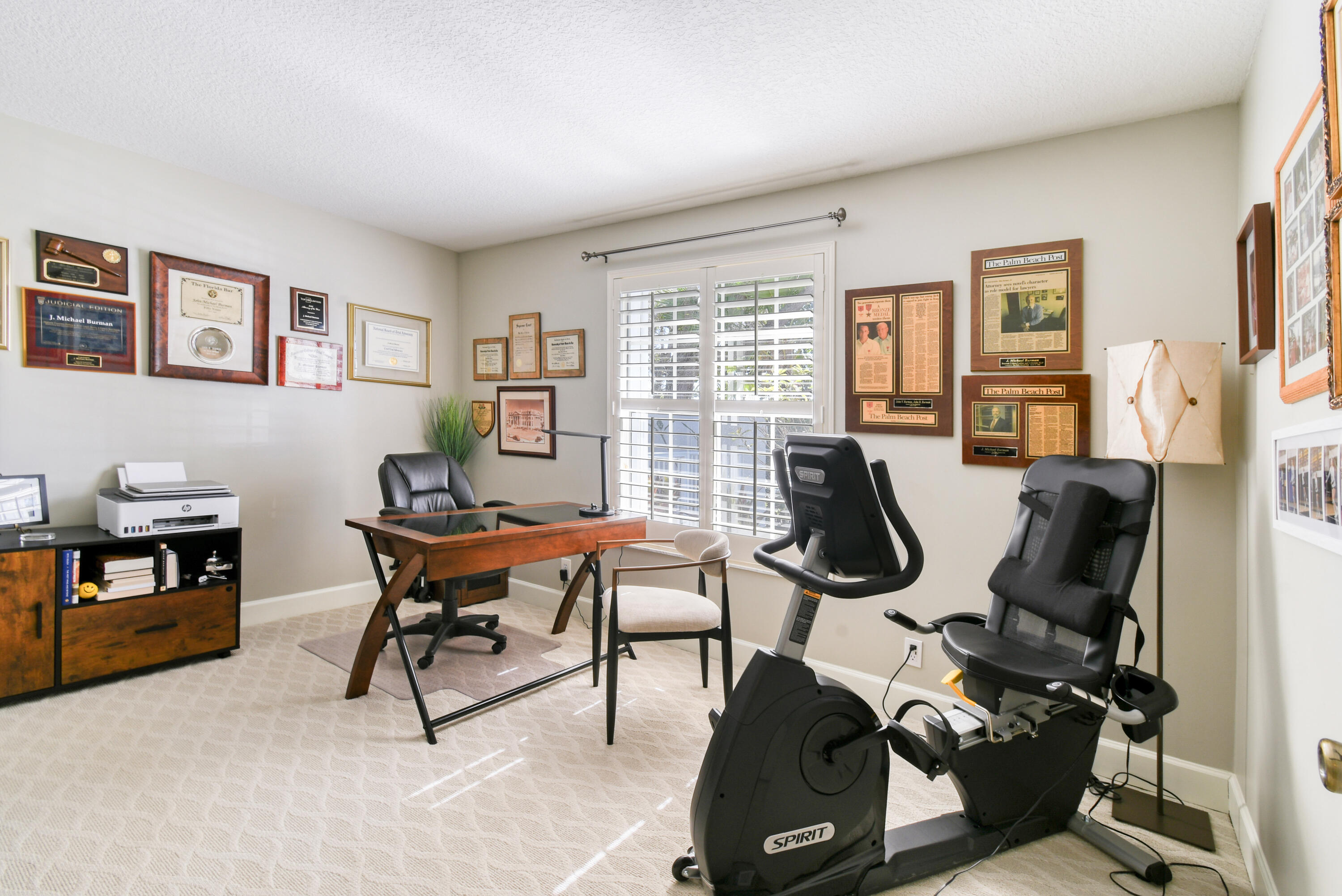 163 Spoonbill Court Jupiter, FL 33458 - Photo 40 of 67 a view of a workspace with furniture and a window