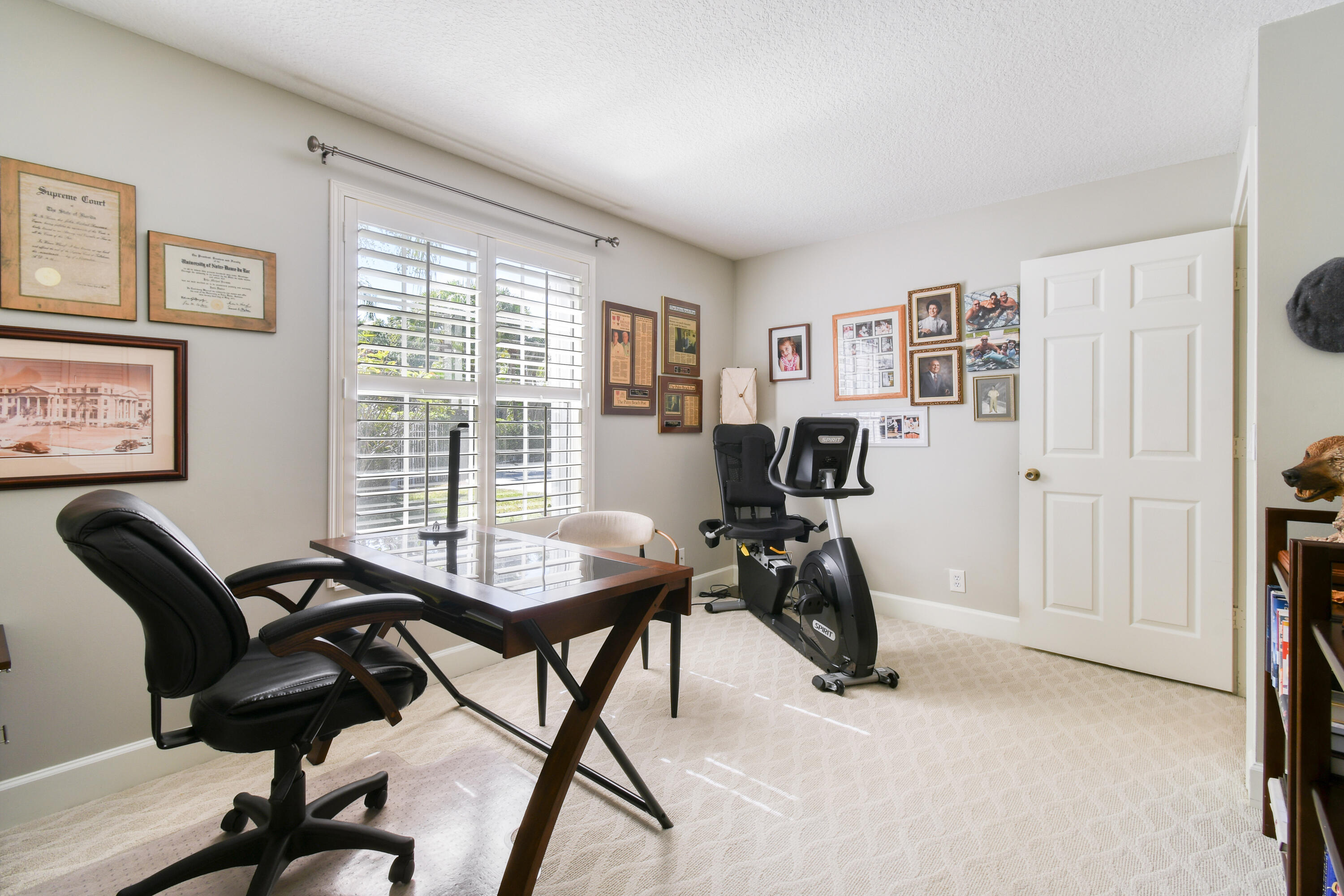 163 Spoonbill Court Jupiter, FL 33458 - Photo 41 of 67 a view of a livingroom with workspace and a window