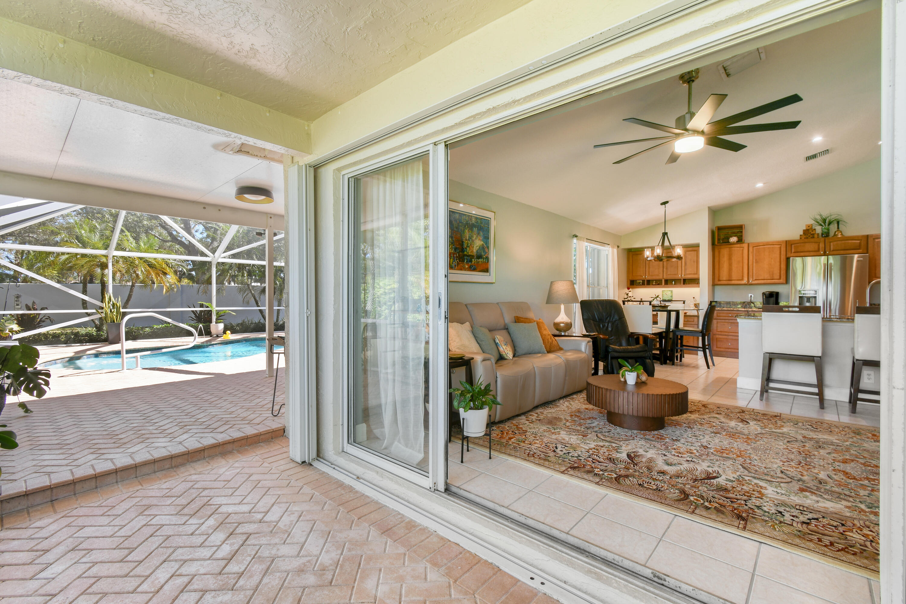 163 Spoonbill Court Jupiter, FL 33458 - Photo 42 of 67 Entrance to outside lanai and pool