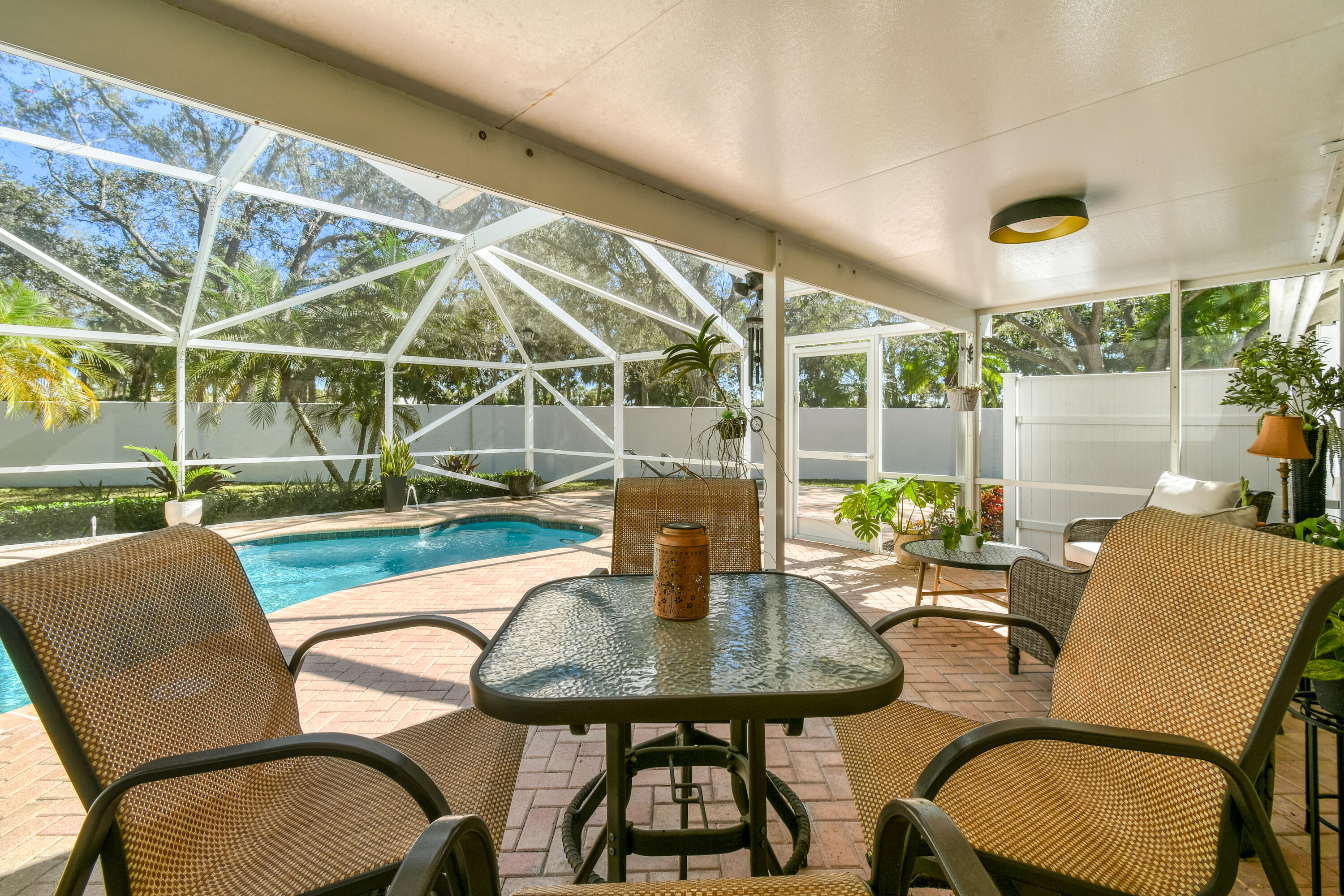 163 Spoonbill Court Jupiter, FL 33458 - Photo 50 of 67 a view of a dining room with furniture window and outside view