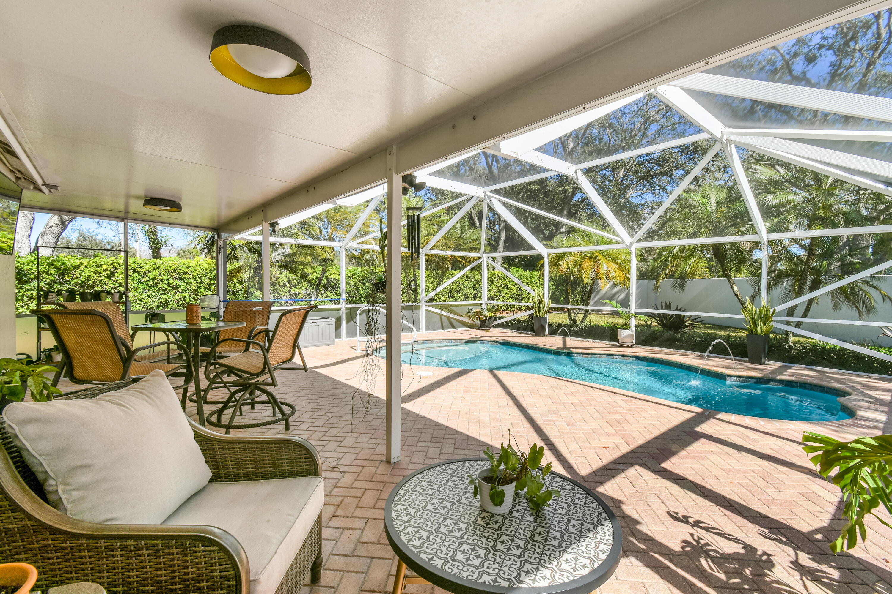 163 Spoonbill Court Jupiter, FL 33458 - Photo 51 of 67 a living room with furniture and a table