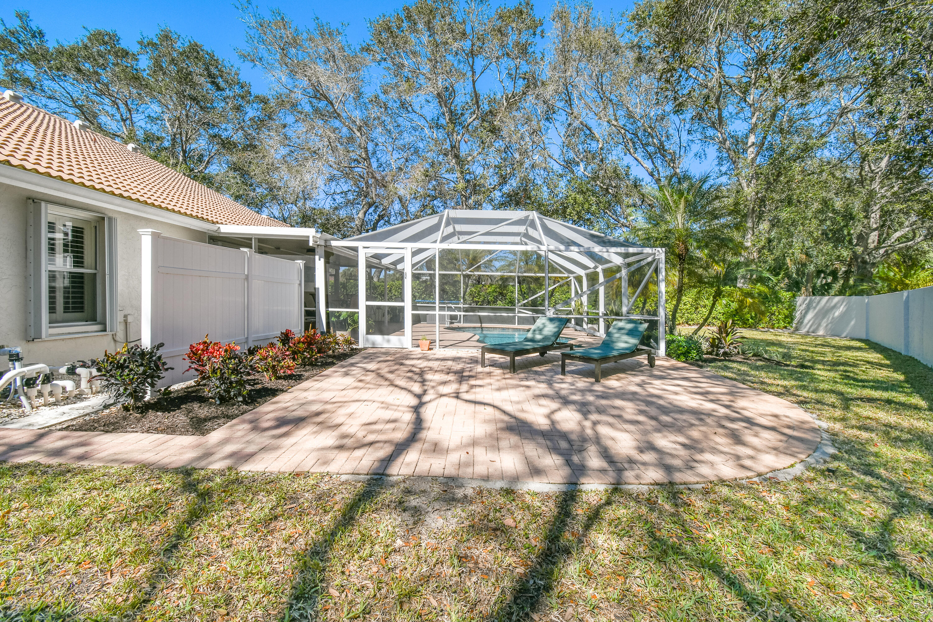 163 Spoonbill Court Jupiter, FL 33458 - Photo 53 of 67 a view of a house with backyard and sitting area