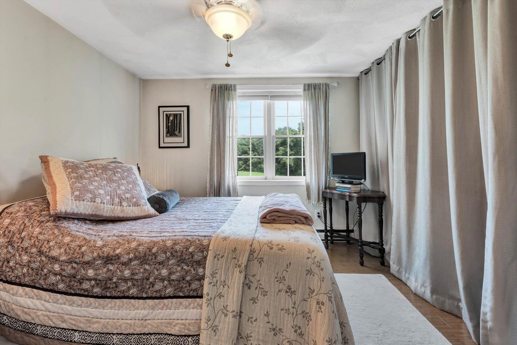 78 Highview Drive Sandwich, MA 02563 - Photo 9 of 20 a bedroom with a bed and a flat tv screen on dresser