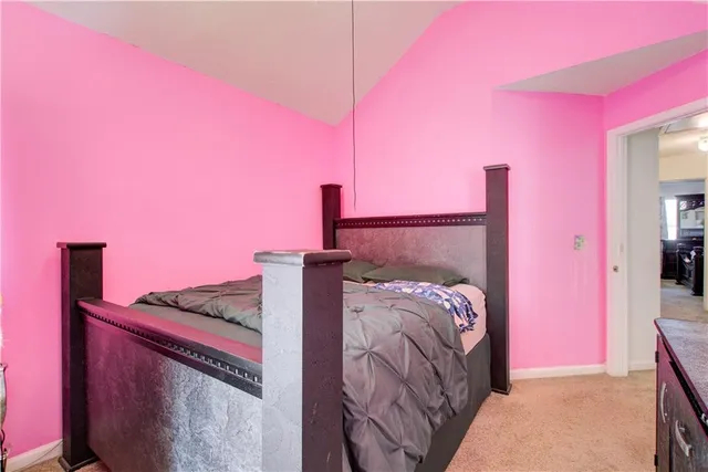 a bed room with a bed and a night stand