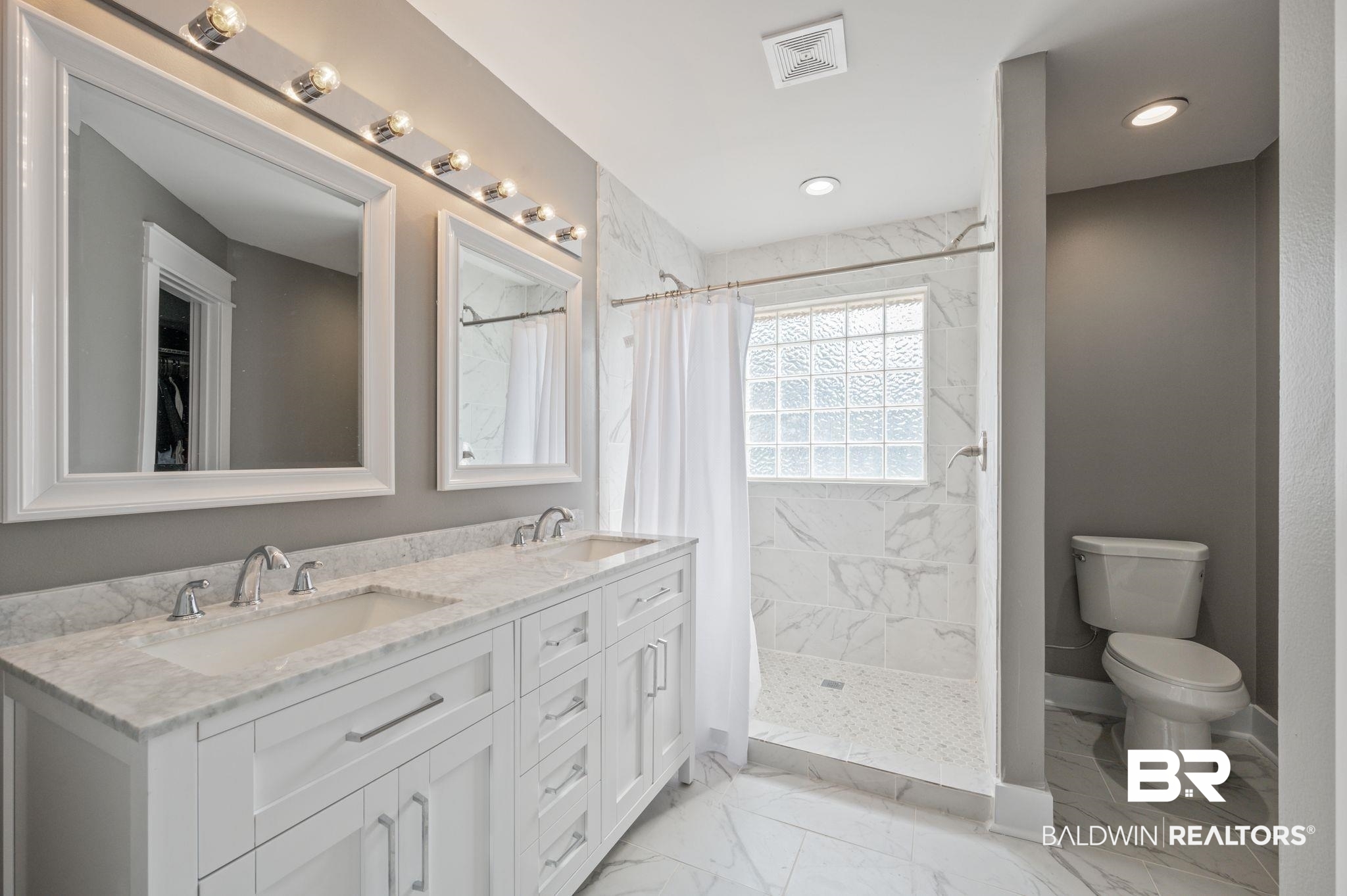 1107 North Oak Street Loxley, AL 36551 - Photo 15 of 40 Bathroom with vanity, toilet, and a shower with shower curtain