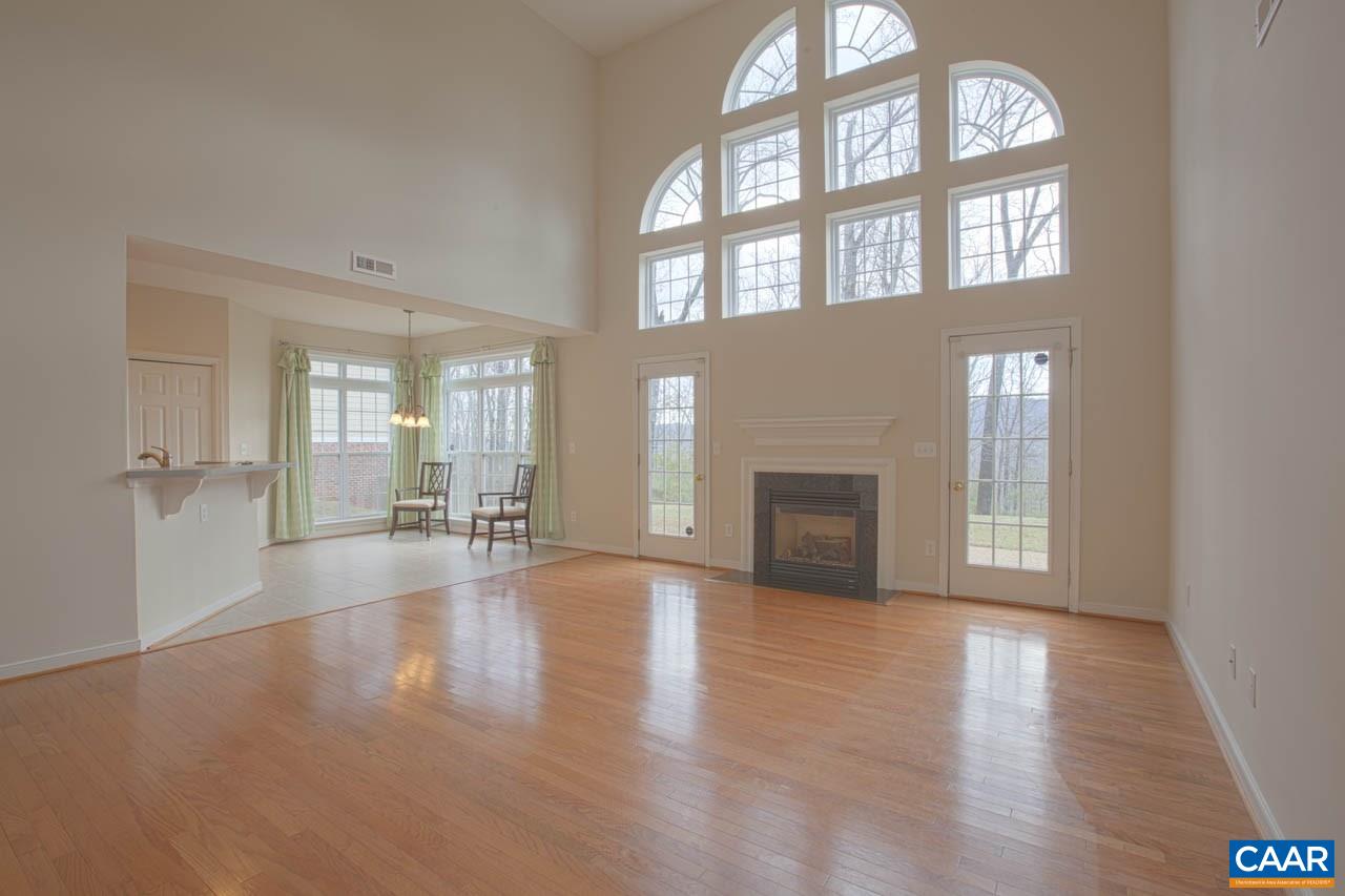 1981 Ridgetop Drive Charlottesville, VA 22903 - Photo 12 of 40 a view of an empty room with wooden floor and a window