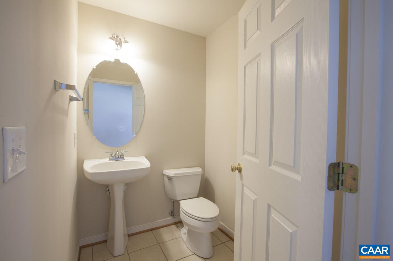 1981 Ridgetop Drive Charlottesville, VA 22903 - Photo 27 of 40 a bathroom with a toilet sink and mirror