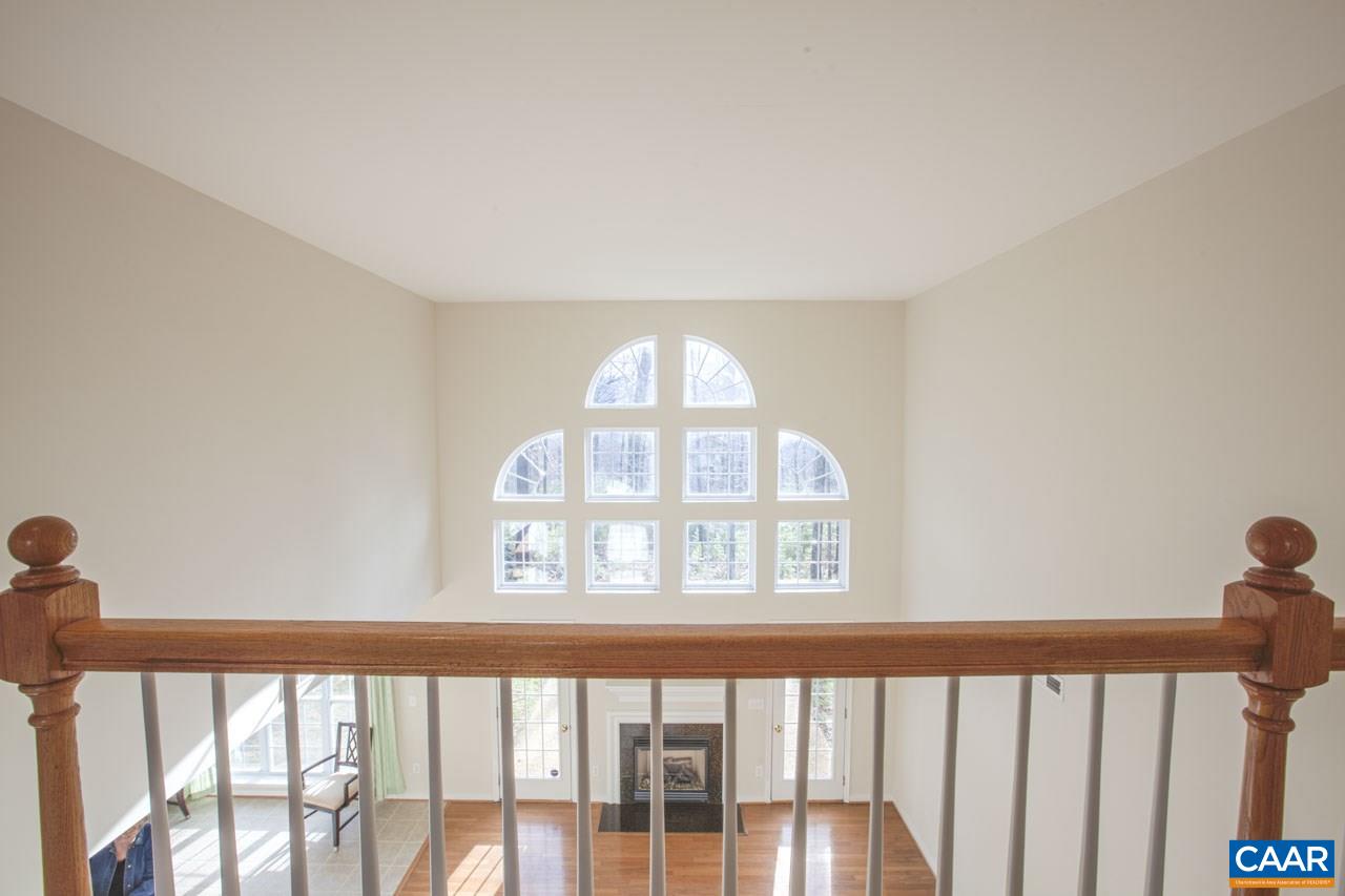 1981 Ridgetop Drive Charlottesville, VA 22903 - Photo 31 of 40 a view of a big room with wooden floor and windows