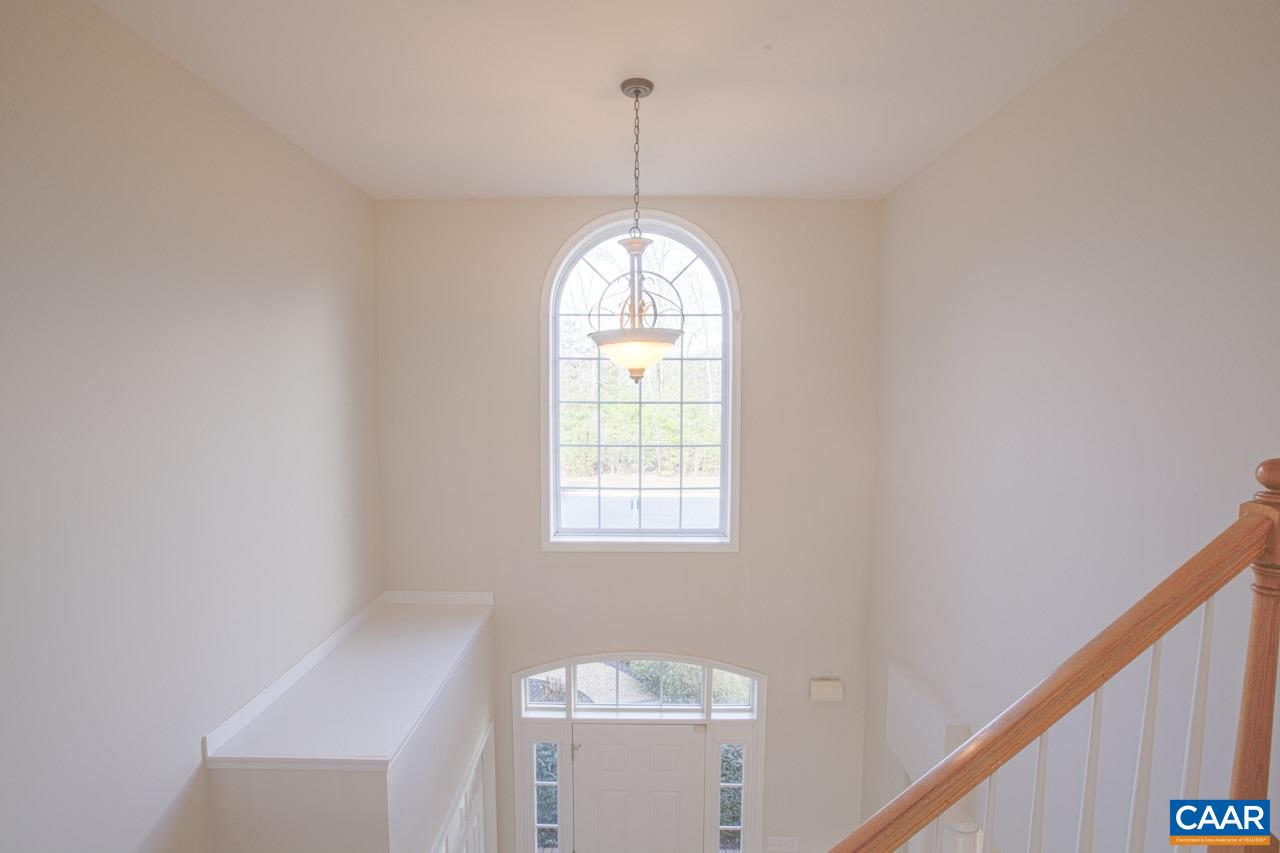1981 Ridgetop Drive Charlottesville, VA 22903 - Photo 38 of 40 a view of a hallway with windows and chandelier