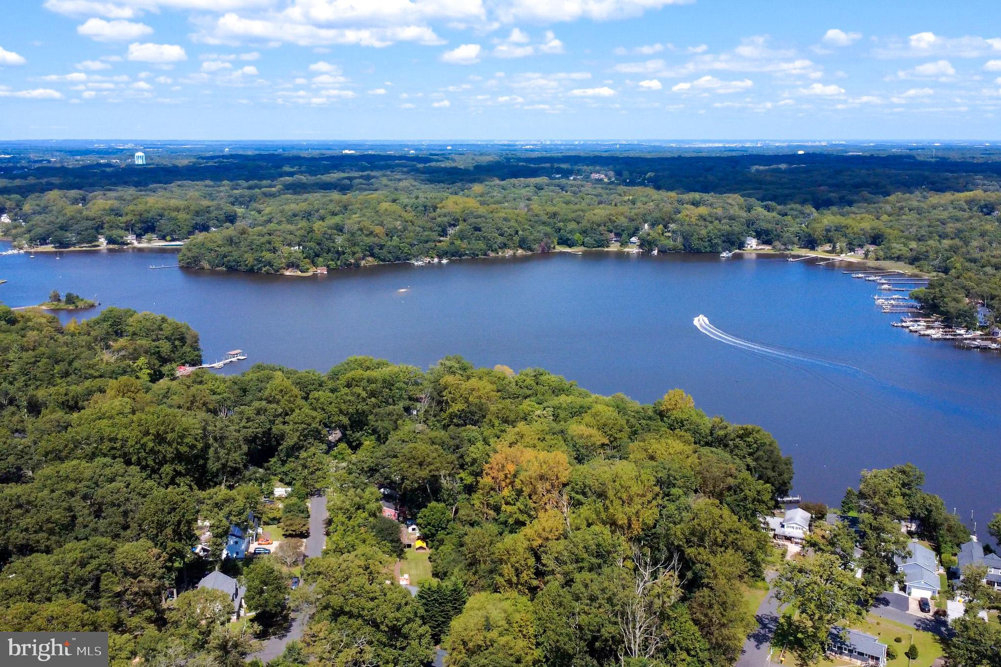 1155 Claire Road Crownsville, MD 21032 - Photo 62 of 62 Serene lakeside retreat surrounded by nature.