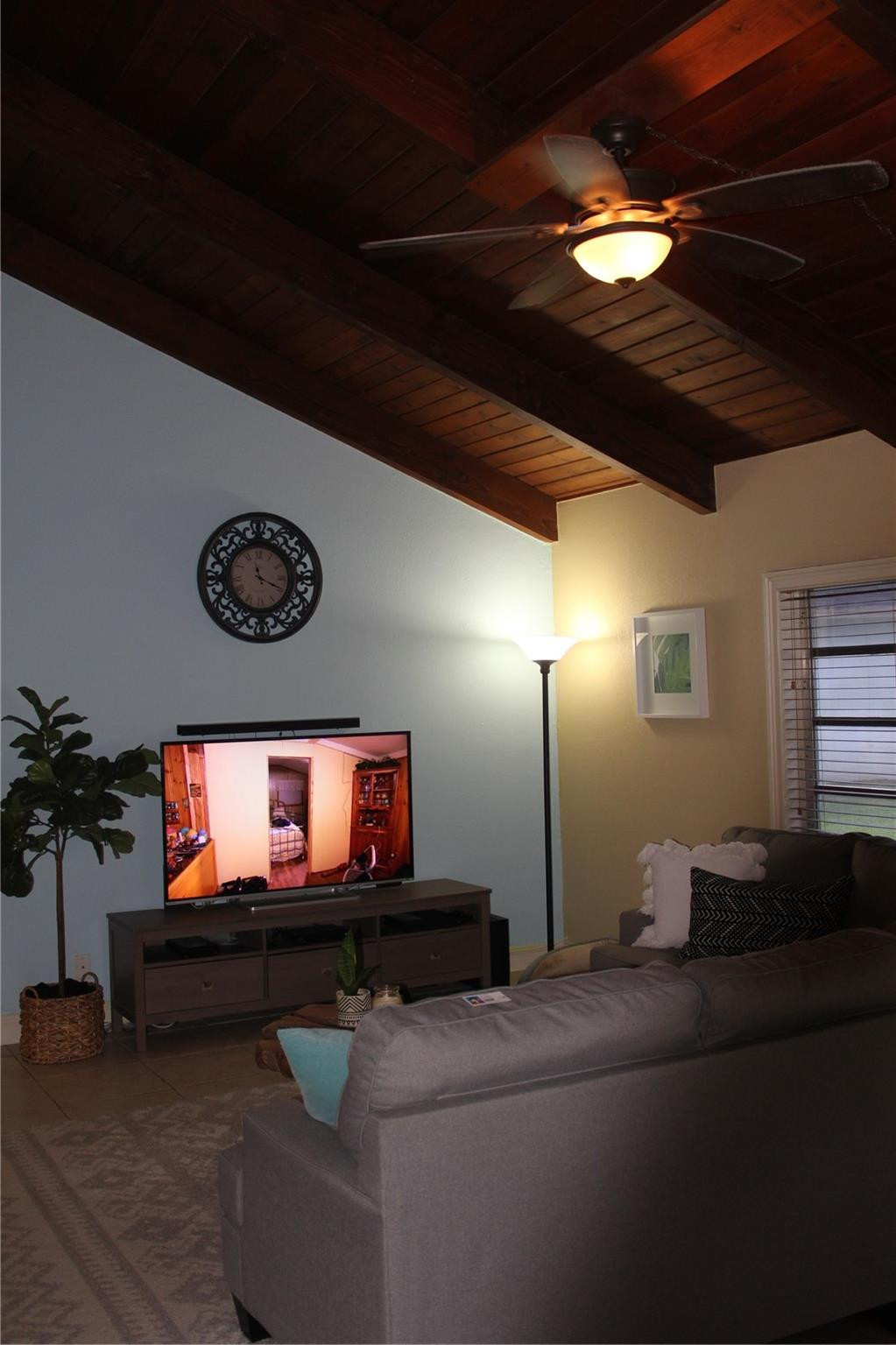 3601 East Forge Road, Unit 23 Davie, FL 33328 - Photo 2 of 17 a living room with furniture and a flat screen tv