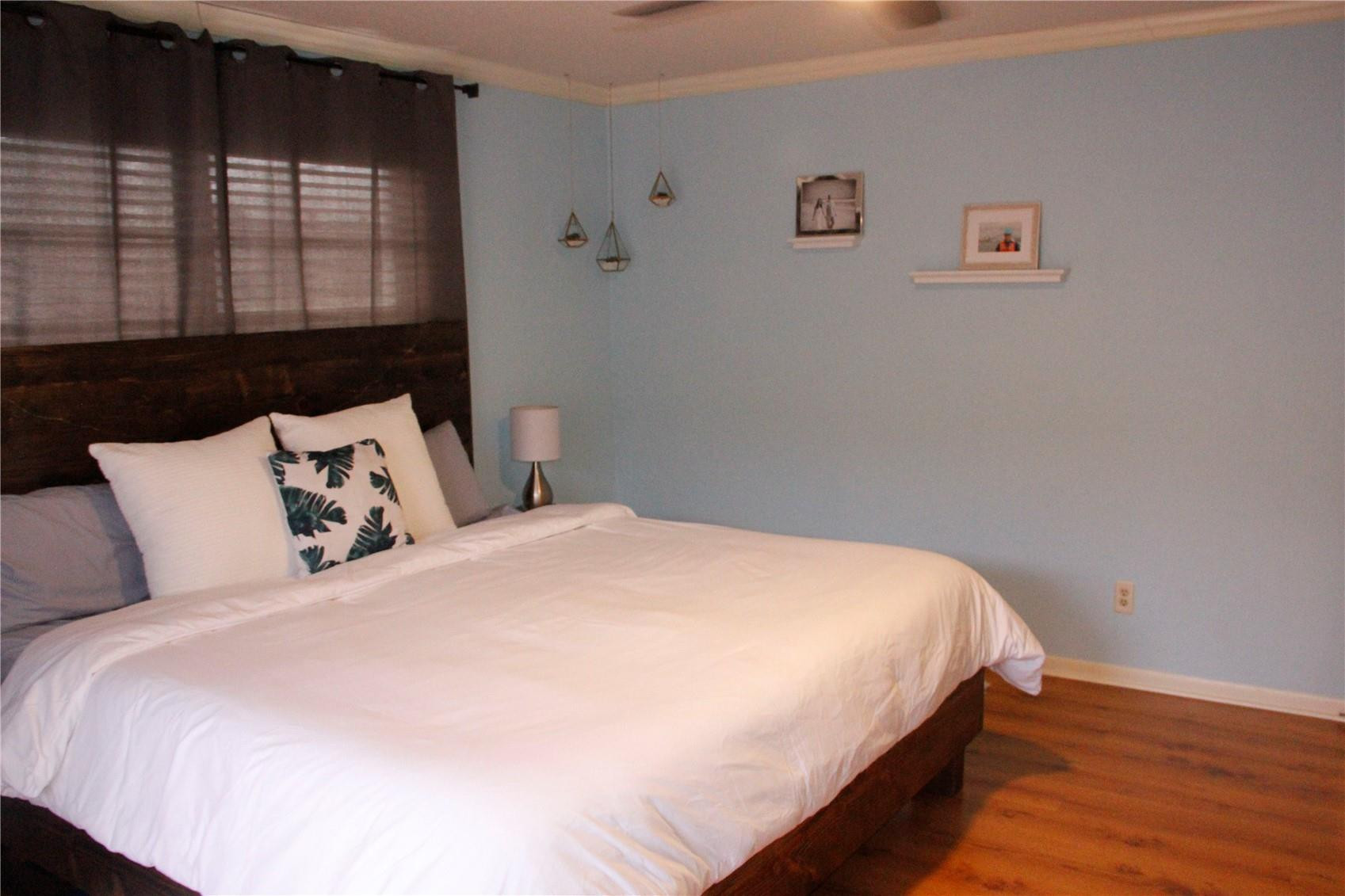 3601 East Forge Road, Unit 23 Davie, FL 33328 - Photo 9 of 17 a bedroom with a bed and wooden floor