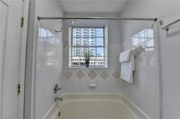 a bathroom with a shower and a bathtub