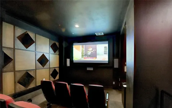 a flat screen tv with wooden floor