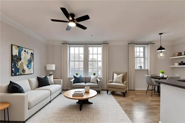 a living room with furniture and a chandelier